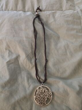 Gold Metal Tree of Life Pendant Necklace on Brown Leather Cord